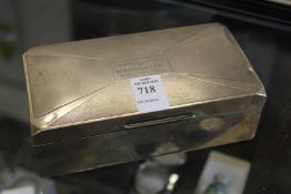 A silver cigarette box with presentation inscription to Major G. C. W. Tugwell OBE.