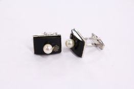 A pair of cufflinks.