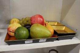 Wax fruit with lacquer dishes.