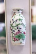 A small Chinese porcelain snuff bottle (small rim chip).