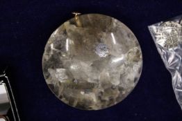 A circular Chinese quartz pendant.