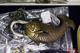 An unusual fish shaped padlock.
