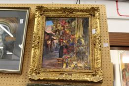 An eastern market scene, oil on board with a decorative gilt frame.