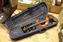 An electronic violin and bow, cased.