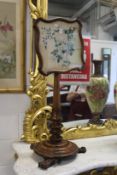 A 19th century rosewood combination pole screen / table.