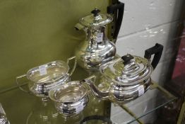 A plated four piece tea service.