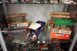 A Mamod Steam Wagon together with an open wagon, boxed and two lumber wagons, boxed and a further