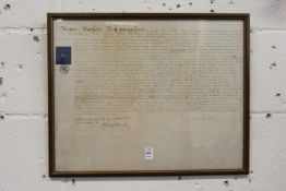 A framed and glazed indenture.