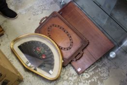 A cased fan, a decorative carved tray and a Shove Ha'penny board.