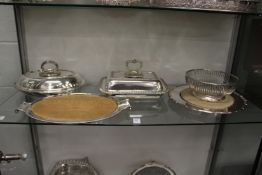 Two entree dishes and covers, two cheese boards with plated stands and a basket.