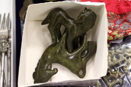 Two small bronze models of horses.