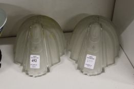 A pair of Art Deco frosted glass shades.