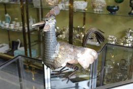 An unusual metal model of a rooster.