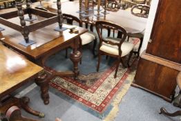 A large Indian carpet, blue ground with floral decorated central motif and border.