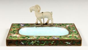 AN ENAMEL DECORATED ASH/PIN TRAY with a jade deer. 5.75ins long, 3.75ins deep.