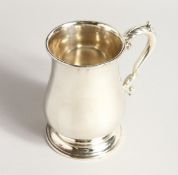 A PLAIN SILVER PINT BALUSTER TANKARD. London 1946, maker C.J. VANDER