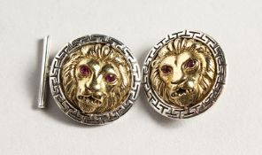 A PAIR OF SILVER AND GOLD PLATED LION HEAD CUFF LINKS