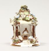 A COALPORT FLOWER ENCRUSTED PASTILLE BURNER. 4ins high.