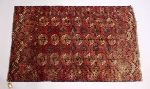 A GOOD EARLY 20TH CENTURY TURKMAN TEKKE RUG, claret ground with three rows of seven gulls. 5ft
