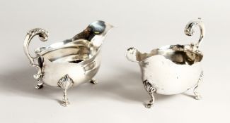 A RARE PAIR OF GEORGE III IRISH SIVER SAUCEBOATS on three pad feet. Cork Circa. 1770 Stamped