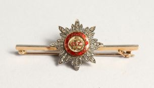 A DIAMOND AND ENAMEL BAR BROOCH 'TRIA JUNTCA UNO'.