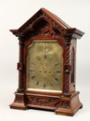 A VERY GOOD REGENCY BRACKET CLOCK by James McCabe with silvered dial movement, 3011. 24ins high.