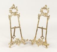 A PAIR OF MEDIUM BRASS EASELS 1ft 4ins high
