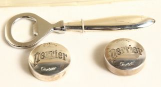 A CARTIER SILVER BOTTLE OPENER in a red case