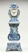 A 19TH CENTURY DUTCH BLUE AND WHITE MINIATURE PORCELAIN LONGCASE CLOCK, the movement by Charles