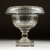 A HOBNAIL CUT CIRCULAR PEDESTAL FRUIT BOWL on a square base. 9ins high.