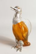 AN AMBER GLASS DUCK CLARET JUG with silver plated mounts, 11ins high.