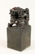 A CHINESE BRONZE DOG OF FO SQUARE SEAL 7.5ins high.