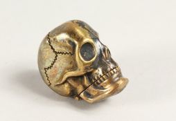 A SKULL BRONZE VESTA