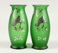 A PAIR OF SILVER OVERLAY GLASS VASES with song birds. 5.5ins high.