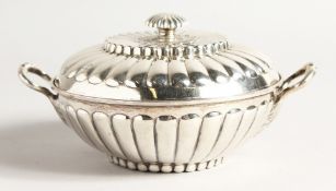 A GEORGE II SILVER CIRCULAR TWO HANDLED ECULLE and cover with fluted decorations. 5.5ins diameter