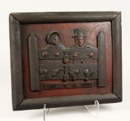 AN AMERICAN WOODEN FOLK ART PANEL Two figures in the stocks, 'Babes in the Wood 15ins x 17ins