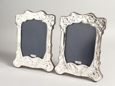 A PAIR OF SILVER BUTTERFLY PHOTOGRAPH FRAMES 7.5ins x 6ins