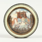 A GEORGIAN TORTOISESHELL CIRCULAR BOX, the top painted with buildings. 3.25INS