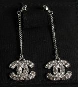A PAIR OF CHANEL STYLE ENTWINED C DROP EARRINGS in a Chanel box.