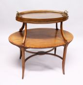 A GOOD MAHOGANY OVAL TWO TIER TABLE with detatchable two handled glass tray on curving support