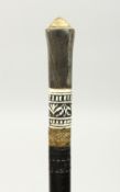 AN EBONY SWORD STICK with bone inlay. 36ins long.