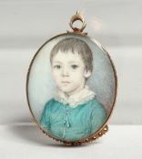 A GEORGIAN OVAL MINIATURE OF A YOUNG BOY, young boys in a gilt frame. 1.25ins x1ins