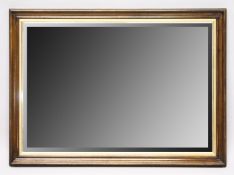 A BEVELLED MIRROR. 55ins x 26ins
