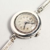 A LADIES CARTIER PLATINUM DIAMOND SET COCKTAIL WATCH 27.5gmS.