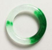 A SPECKLED HARDSTONE BANGLE.