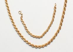 A 9CT GOLD ROPE CHAIN BRACELET and NECKLACE Matching hallmarks, maker JN 80cm and 19cm long 53gms