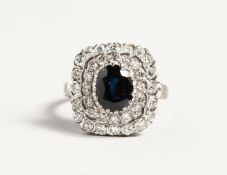 A SUPERB 18CT WHITE GOLD SAPPHIRE AND DIAMOND CLUSTER RING.