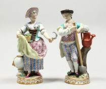 A VERY GOOD PAIR OF MEISSEN PORCELAIN FIGURES, GARDENER AND GARDENERESE, the man standing holding