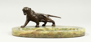 AN ART DECO ONYX DESK STAND with a chrome tiger. 9.5ins long.