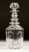 A HEXAGONAL CUT GLASS DECANTER AND STOPPER